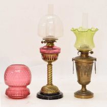Two late Victorian or Edwardian brass oil lamps