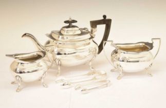 Silver three-piece tea set and two pairs of silver sugar tongs