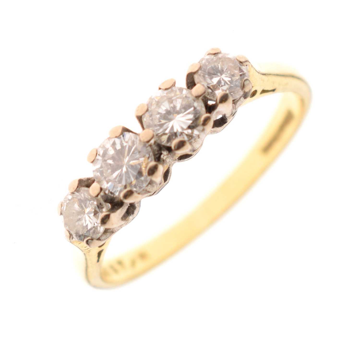 18ct gold ring set four brilliant cut diamonds