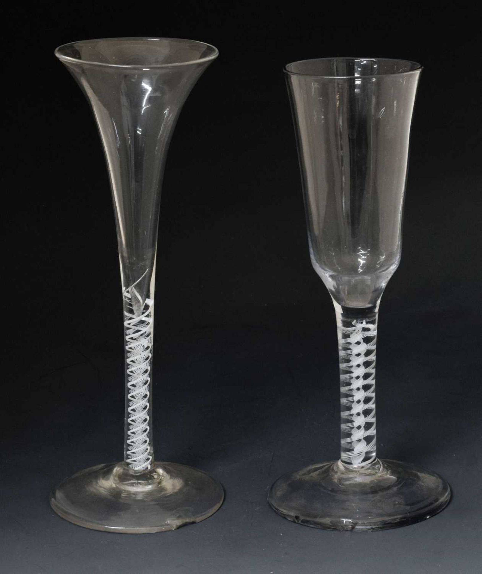 Two opaque twist stem wine or cordial glasses