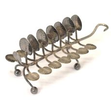 Victorian silver toast rack having seven branches with lily pad terminals