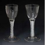 Two similar opaque twist stem wine or cordial glasses