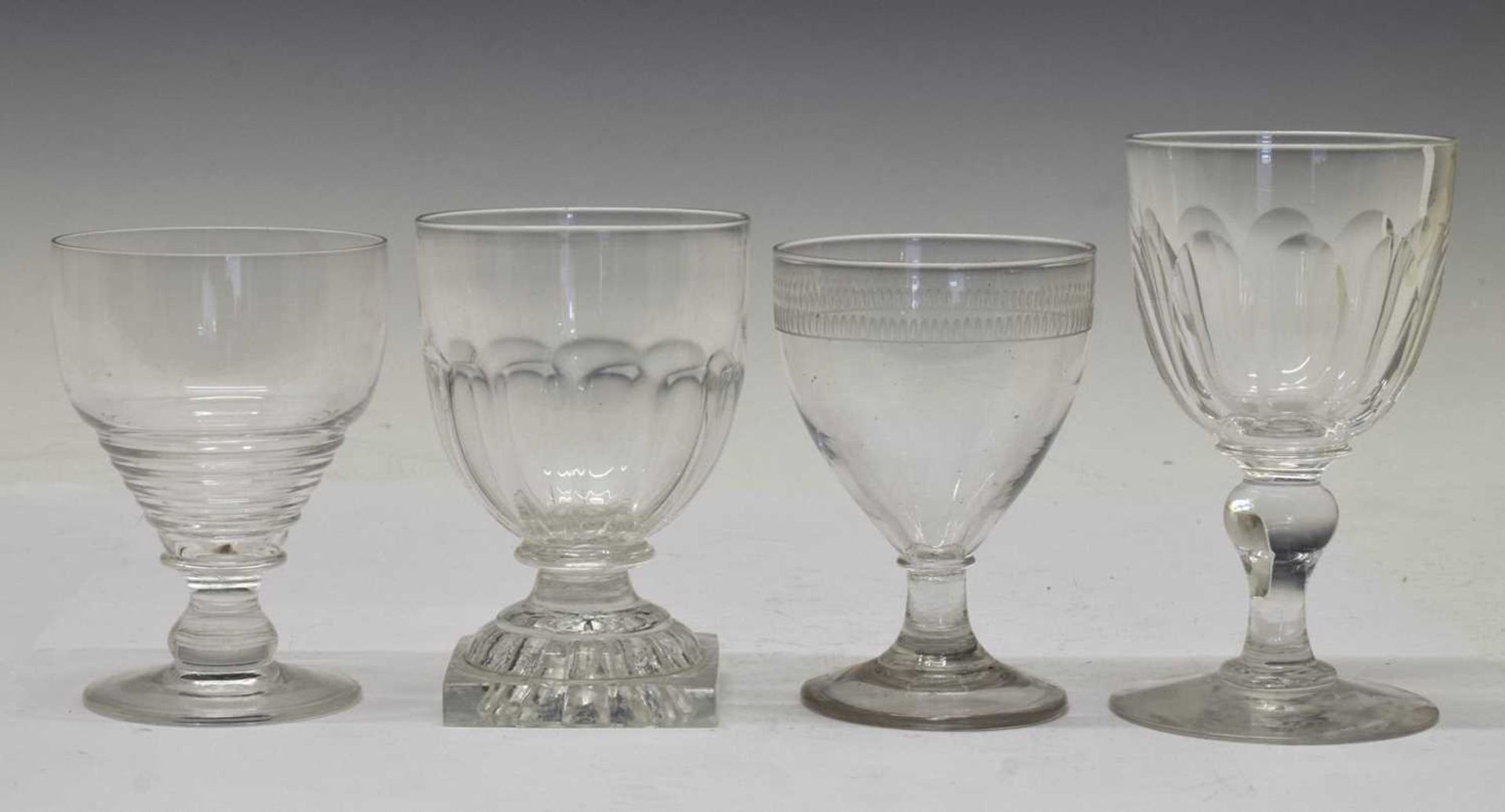 Four early 19th century glass rummers