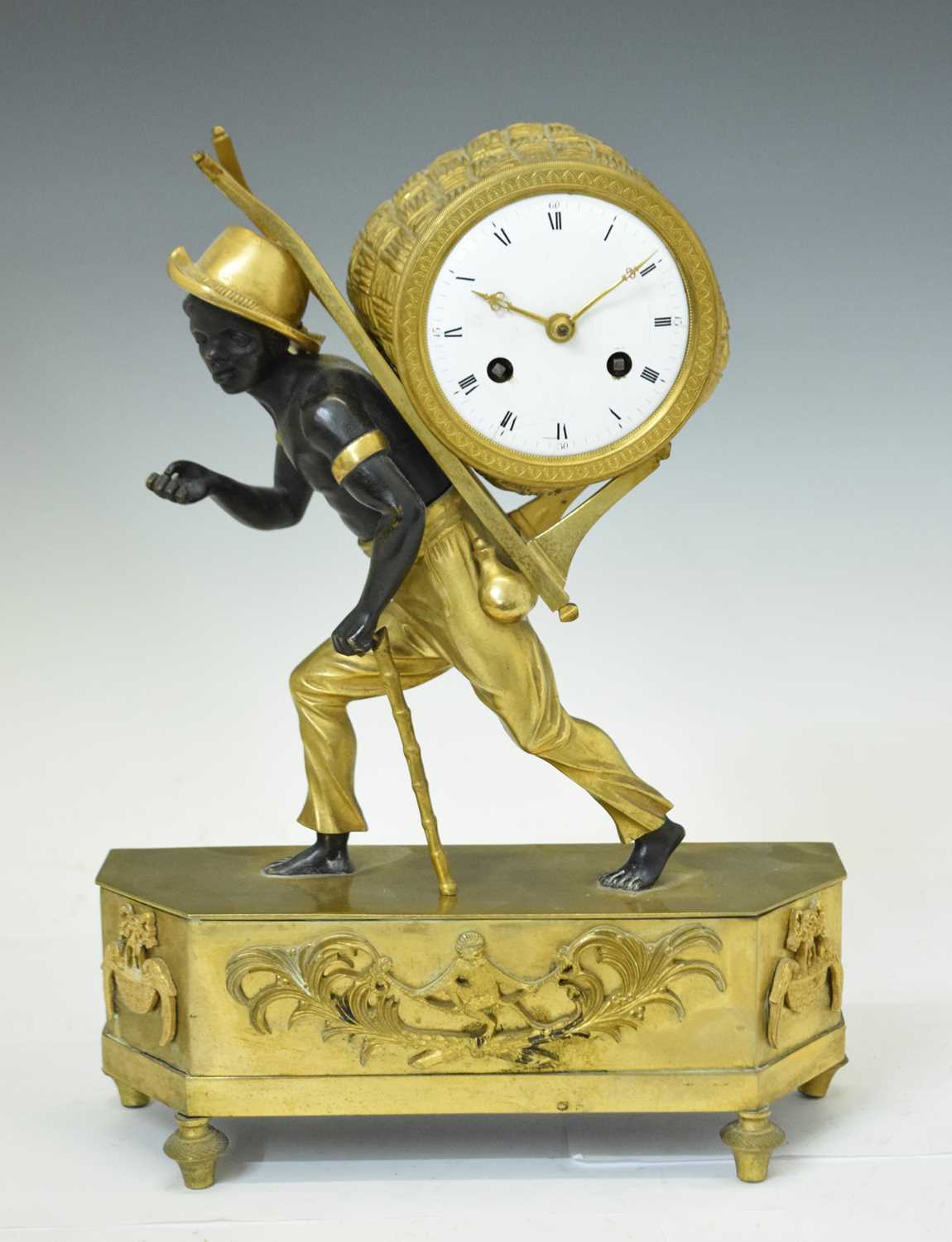 Early 19th century French Empire patinated bronze and ormolu figural mantel clock