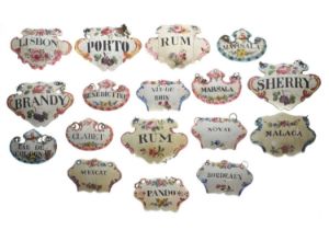 Collection of seventeen mid 18th century and later enamel wine and spirit decanter labels