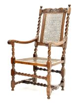 Late 17th century and later walnut cane seated high back open armchair