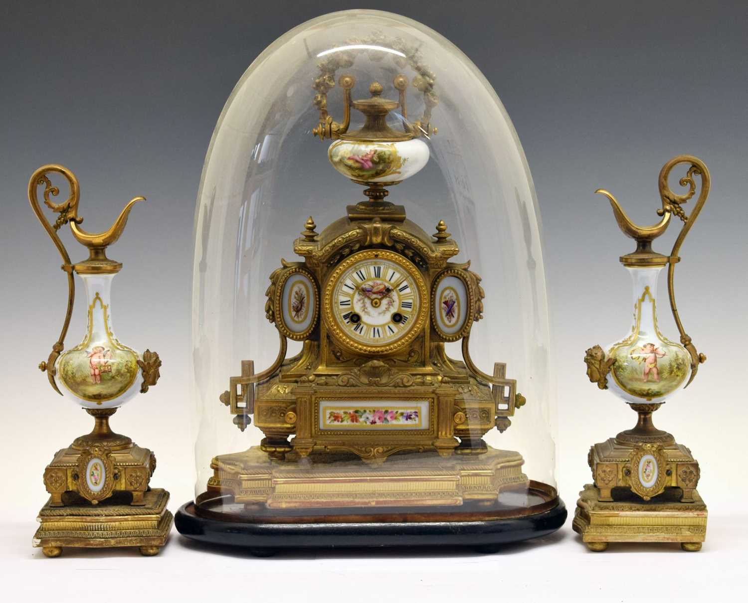 Late 19th century French gilt spelter and porcelain three-piece clock garniture