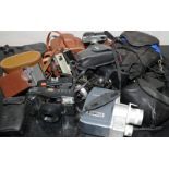 Collection of vintage cameras to include an Olympus OM10 and a pair of vintage tinted goggles