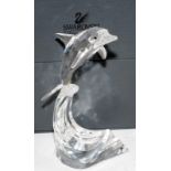 Large Swarovski leaping dolphin c/w protective hard case, no certificate. 22cms tall