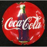 A Coca Cola enamel sign.