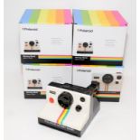 Four novelty ceramic money boxes in the form Polaroid instant cameras. Brand new and boxed