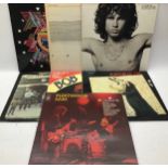 7 VINYL LP RECORDS. In this lot we find albums from - Hawkwind - The Doors - Robert Palmer - Bob