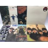 COLLECTION OF 8 BEATLES ALBUMS. Firstly we have a copy of The White Album with embossed cover