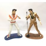 TWO ELVIS PRESLEY FIGURES. Here is Elvis posing in two of his iconic costumes from the Leonardo