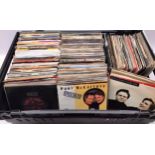 LARGE MIX-MASH CRATE OF 7” SINGLES. Various decades and genres of 45rpm singles here found mainly in