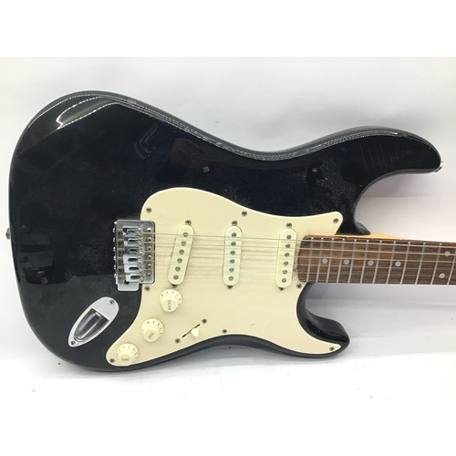 SQUIER FENDER STRAT ELECTRIC GUITAR. Finished in Black and a 1996 50th Anniversary model. Has a