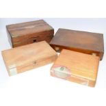 An antique brass bound wooden box c/w three cigar boxes, one containing used aluminium cigar tubes