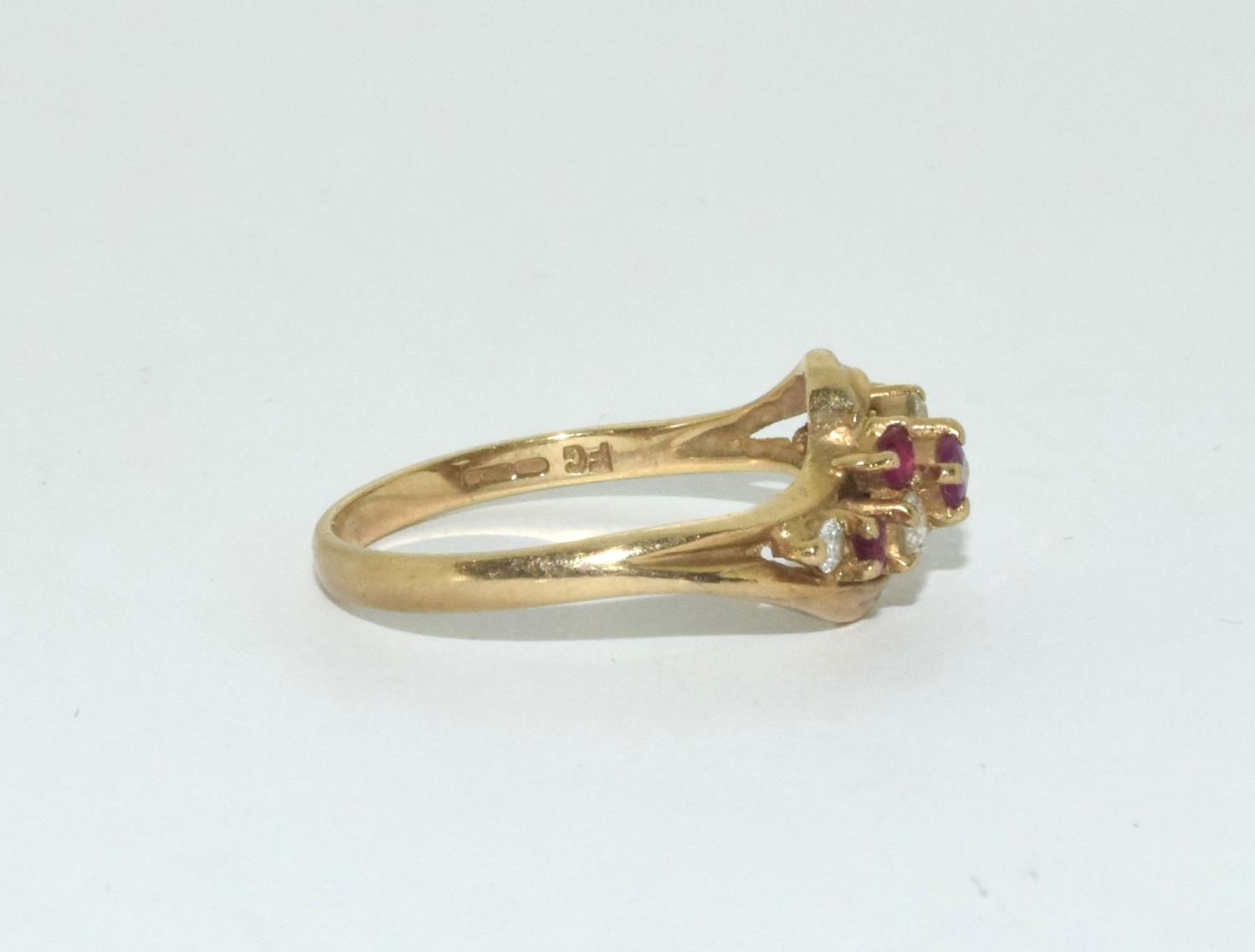 9ct gold ladies diamond and ruby twist ring size N - Image 2 of 6