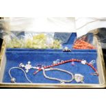 Vintage jewellery box containing jade beads, a coral necklace requiring attention and Links of