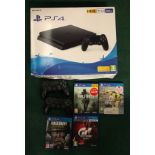 Boxed PS4 with games and two controllers. (110)