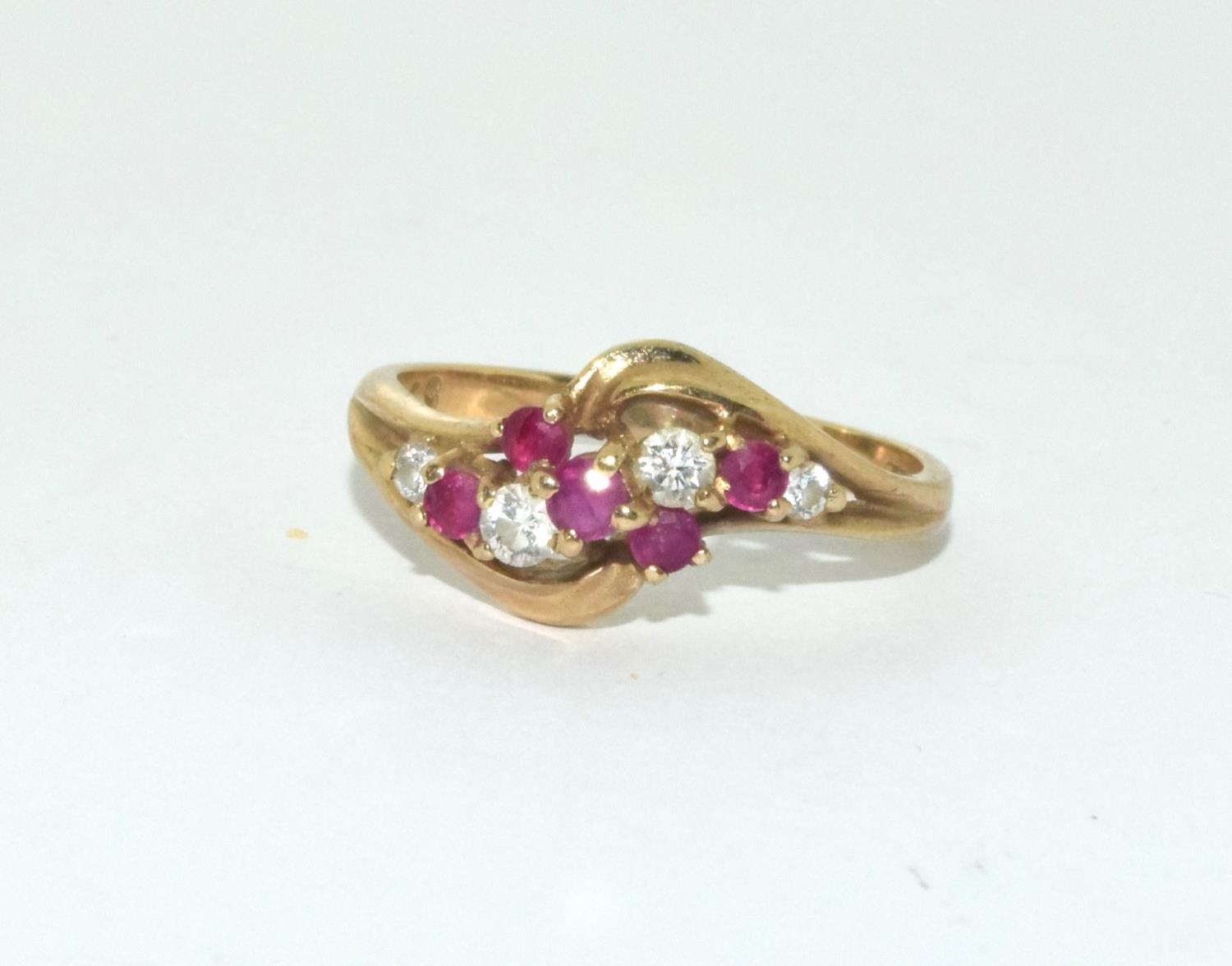 9ct gold ladies diamond and ruby twist ring size N