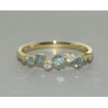 A 9ct gold blue and white diamond ring.