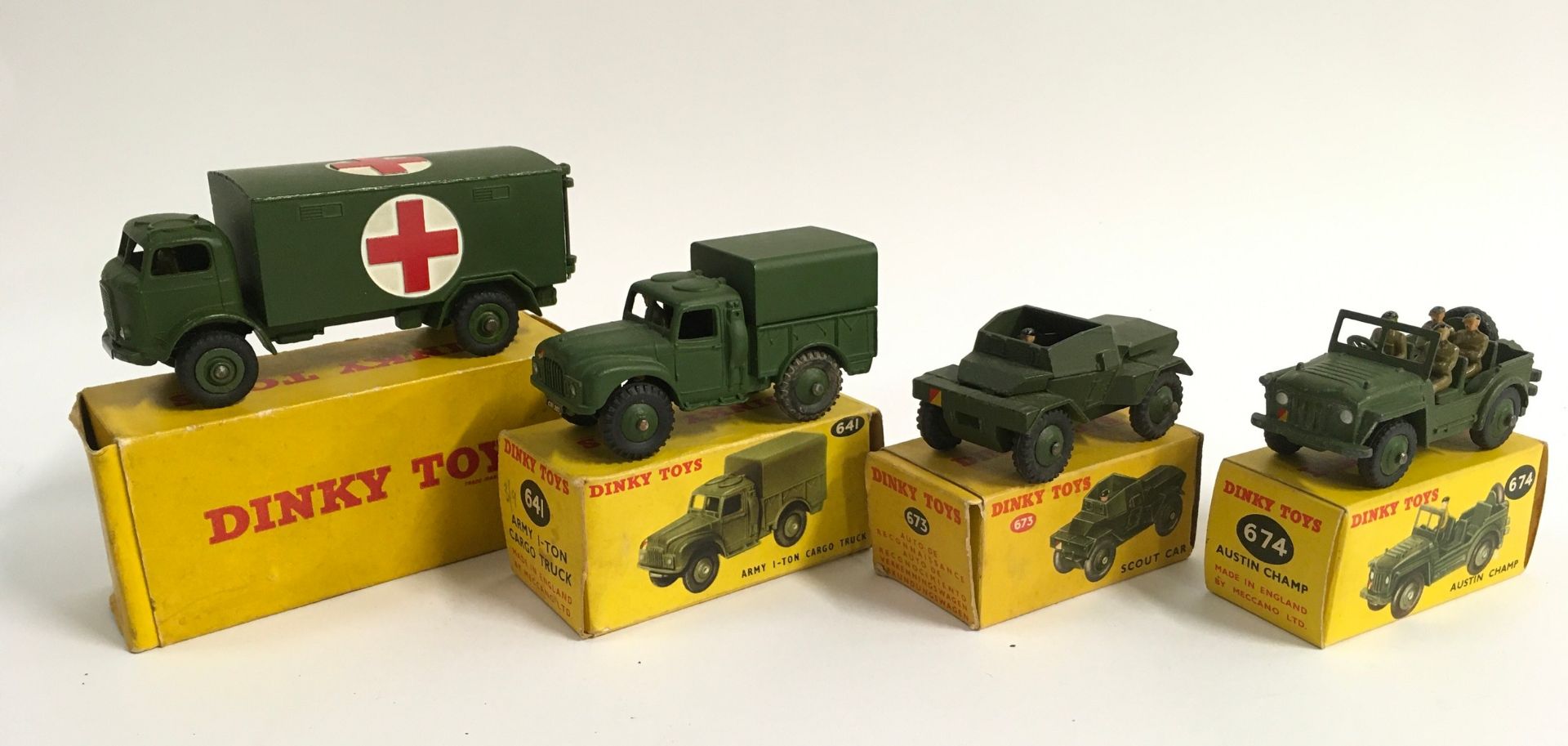 Dinky Military boxed group to include 626 Ambulance, 673 Scout Car with driver, 674 Austin Champ