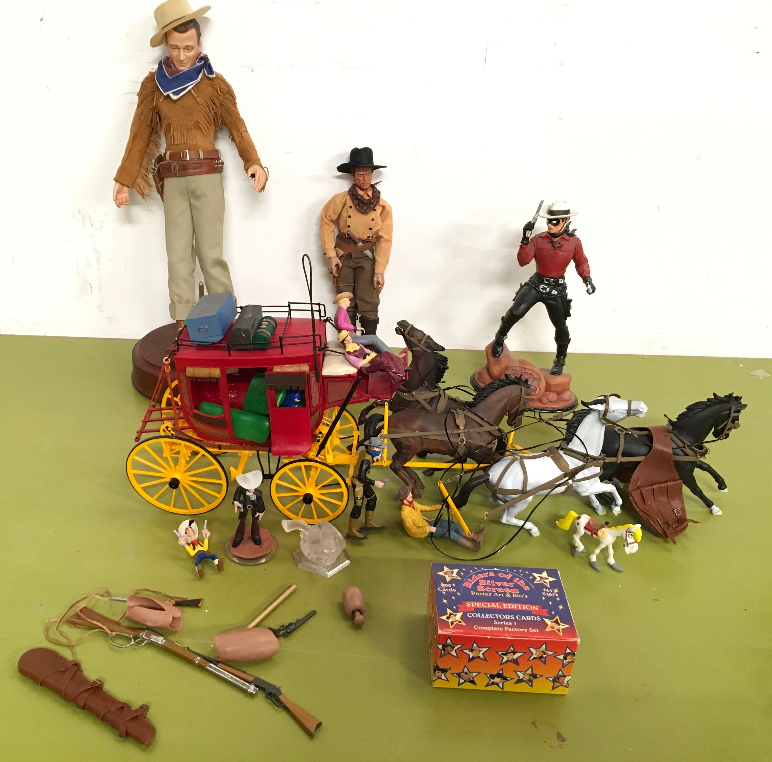 Collection Wild West related items to include stagecoach, musical John Wayne figure, The Lone Ranger