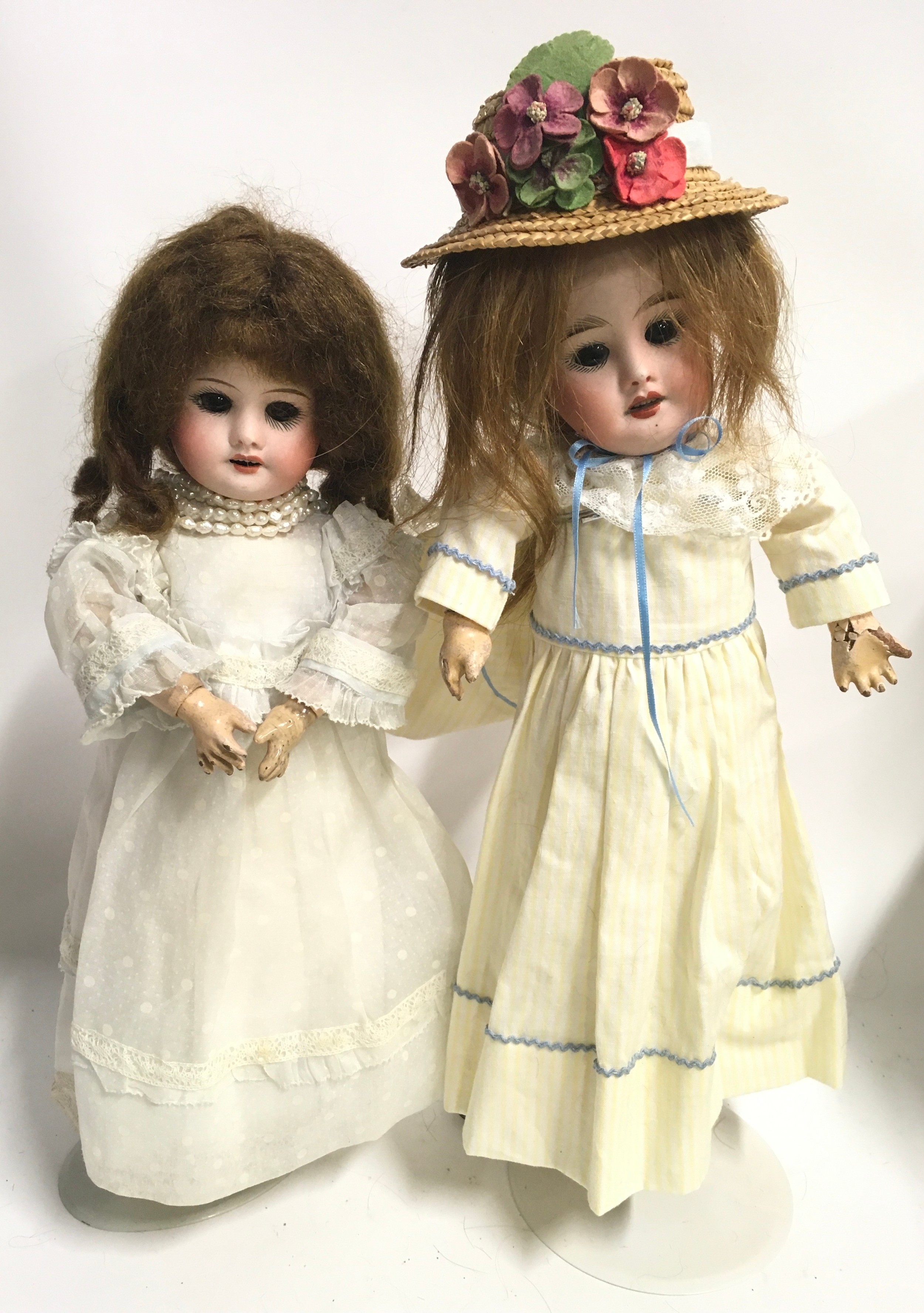 Pair of SFBJ French bisque antique dolls, 1920s, impressed SFBJ 60 PARIS 3/0 and 4/0 weighted