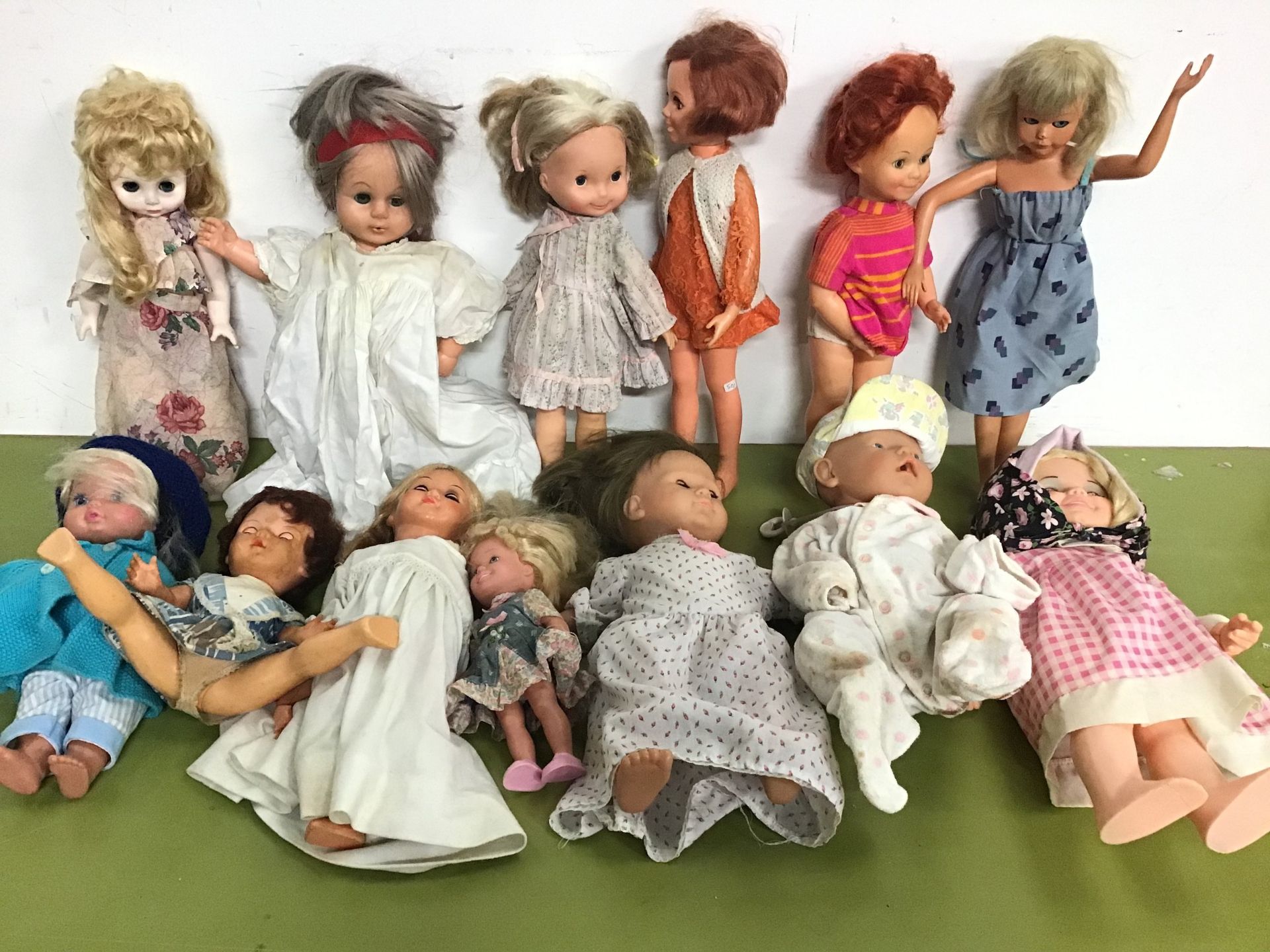 Collection of vinyl and plastic dolls by various makers including Ideal Toys, Mattel, Kenner