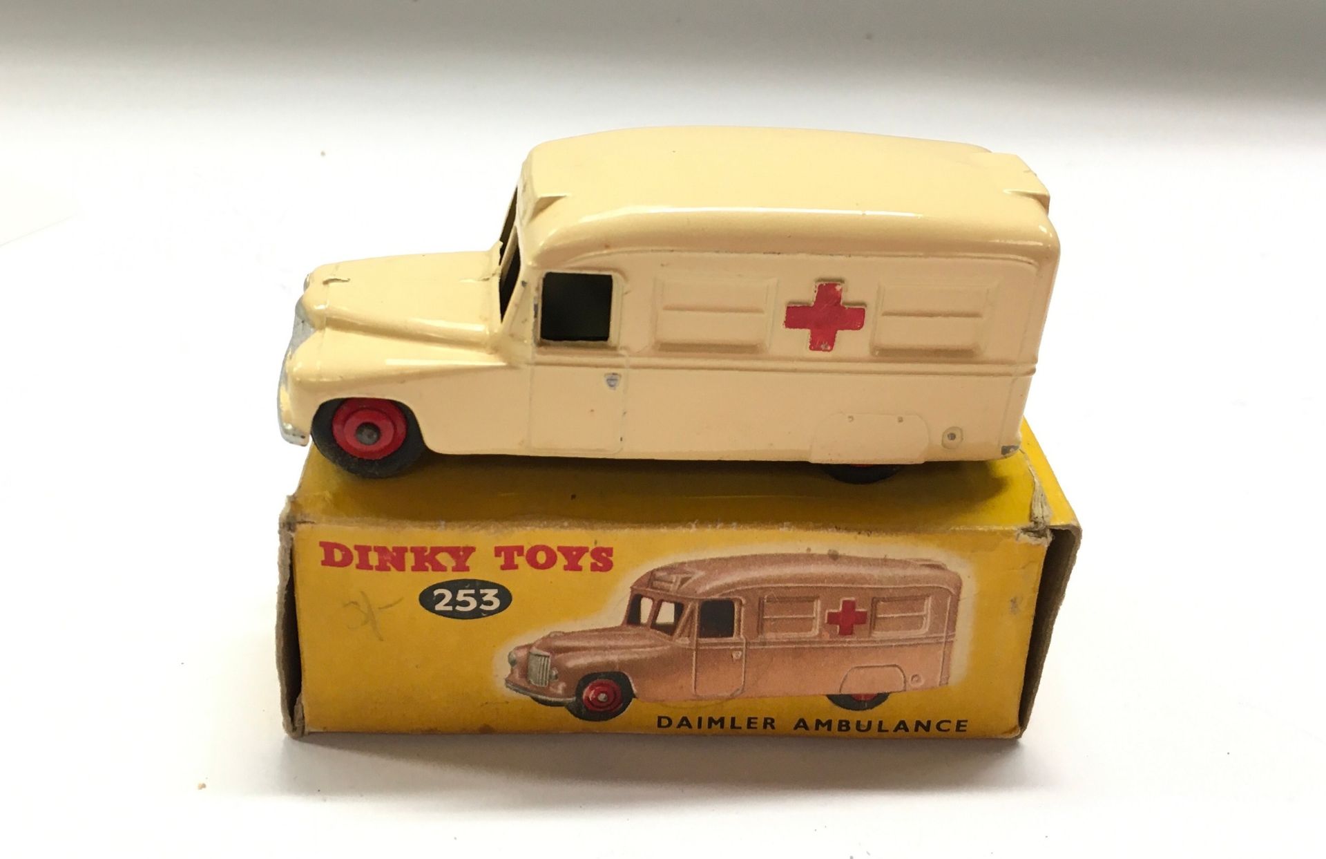 Dinky 253 Daimler "Ambulance" - deep cream body, silver trim, red ridged hubs with smooth tyres, red