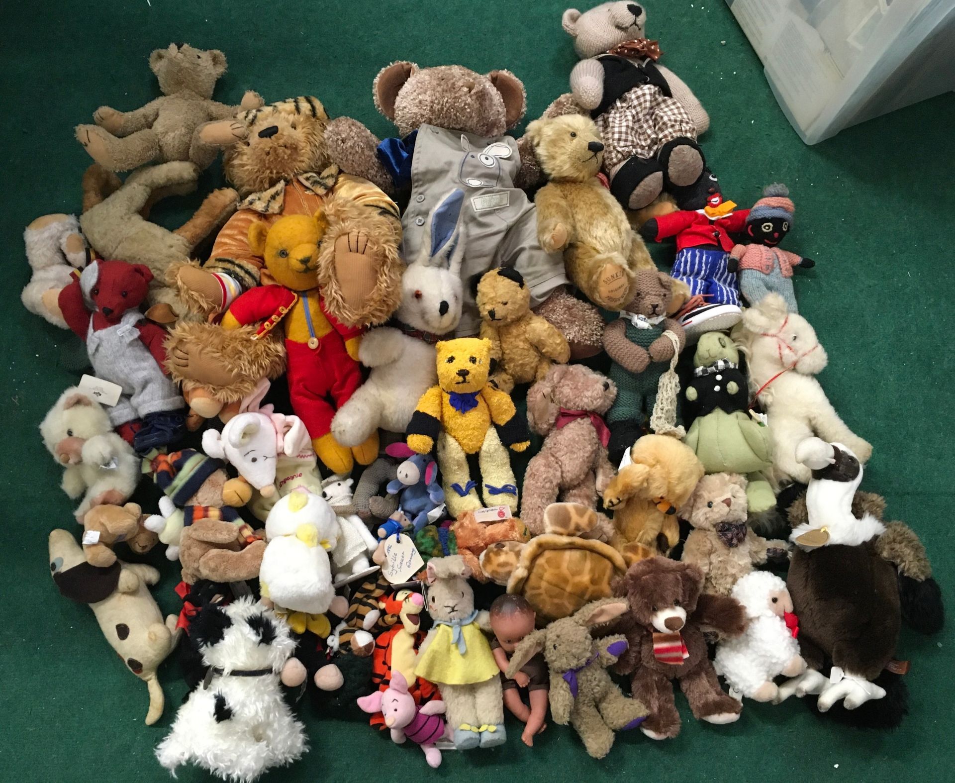 Collection of various teddies and plush toys.