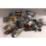 Various unboxed Lego sets with instructions including Minifigures sets - see photos.