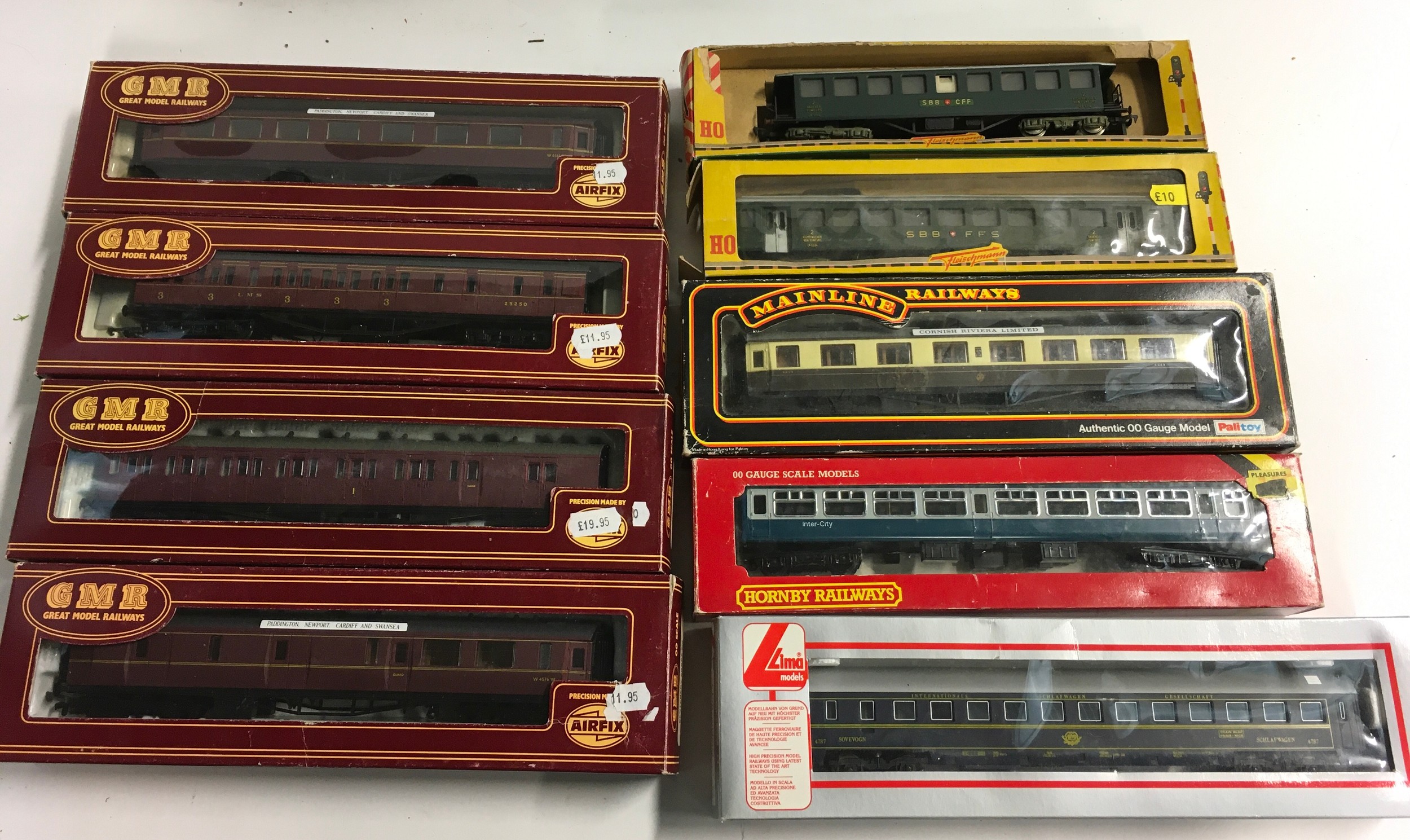 9 various OO/HO mixed region coaches by GMR, Fleischmann, Lima, Hornby and Mainline, boxed.