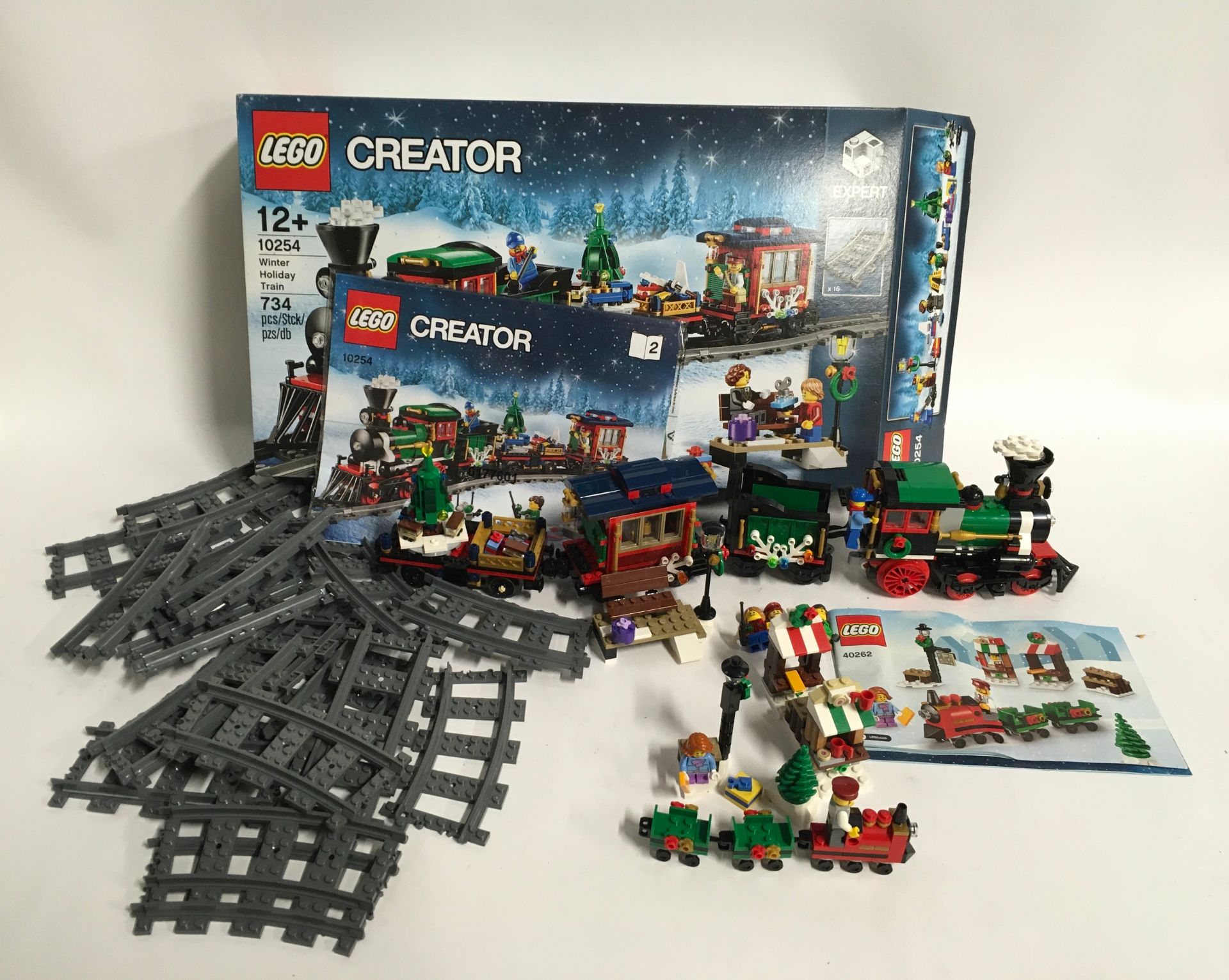 Lego Creator 10254 Winter Holiday Train set and 40262 Christmas Train Ride. Both sets have a few