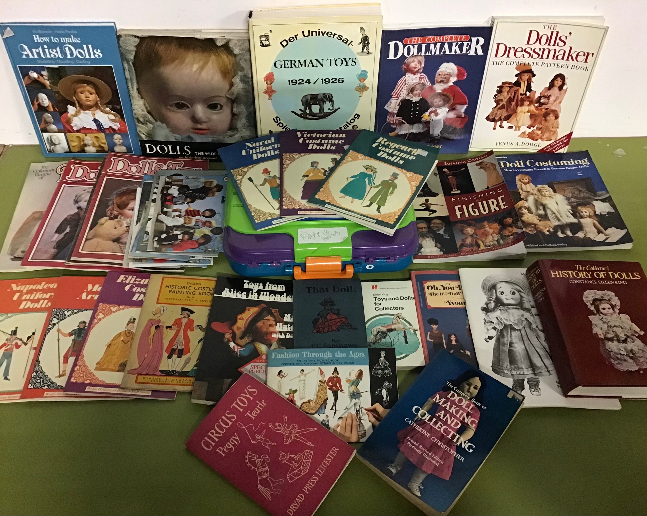 Collection of mainly dollrelated books to include How to make Artists dolls, Doll Costuming, History