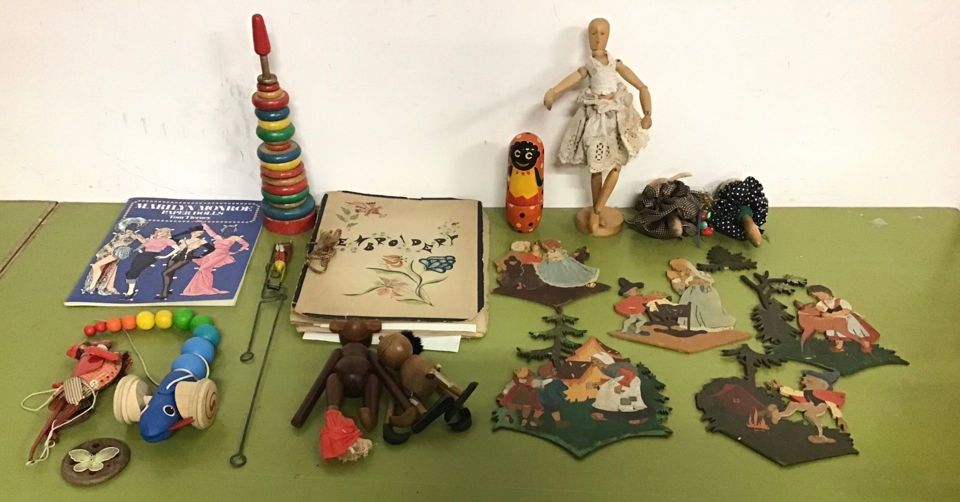 Collection of vintage wooden and tinplate toys to include nursery cutouts, wooden pop up Pluto