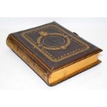 Victorian musical photograph album with gilded tooled leather boards. Good cosmetic condition. no