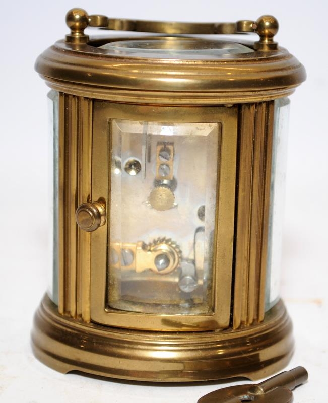 Quality Matthew Norman miniature oval carriage clock with key. Seen working. All bevelled glass - Image 3 of 5