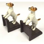 A pair of cast metal book ends depicting Jack Russell Terriers each measuring 15x9x8cm.