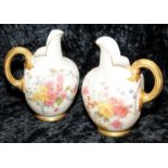 Pair of antique Royal Worcester blush ivory gilded flat back jugs with hand painted floral