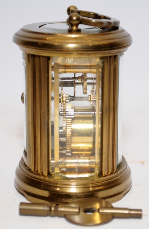 Quality Matthew Norman miniature oval carriage clock with key. Seen working. All bevelled glass - Image 4 of 5