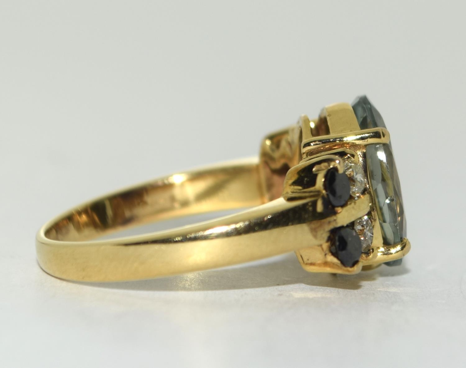 Yellow metal Black and White Diamond with Blue Topaz centre stone. Size Q. - Image 2 of 5