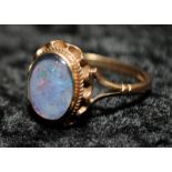 A 9ct gold and opal doublet ring Size N