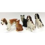 Two Beswick cats together with two Beswick dogs and another by Royal Doulton (5).