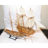 Two large twin masted model sailing ships with sails and rigging on display stands. Length of