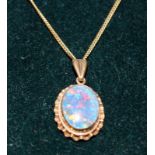 Opal doublet pendant on 9ct gold chain, 4.7g