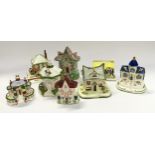 Collection of Coalport and other porcelain cottages (8).