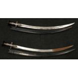 Pair of antique swords with leather sheaths.