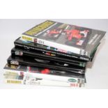 Collection of Formula One annuals to include FIA annual '89 and '90. F1 Behind the Scenes 2002,